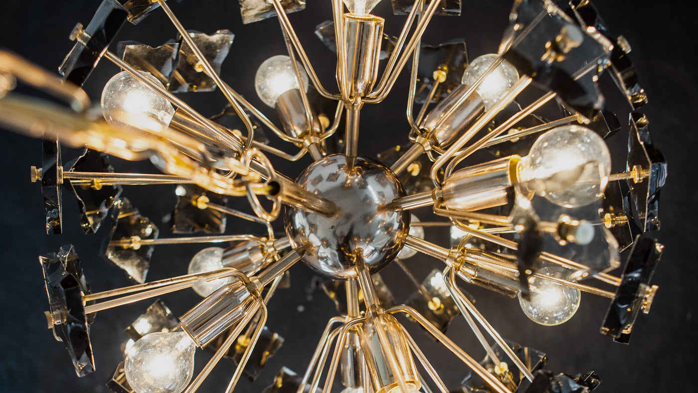 A close up view of Rose Gold Sputnik Chandelier by Fontana Arte, part of the antique collection at Remains Lighting Co.