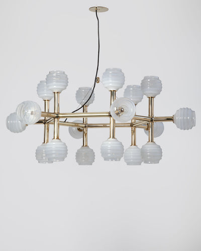 Robert and Trix Haussmann Collection image 1 of a Molecule Hex Chandelier with Beehive Glass made-to-order.  Shown in Polished Brass with Sfumato glass.