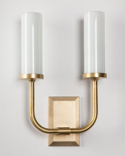 Remains Lighting Co. Collection image 1 of a Aloysius Twin Sconce with Glass Cylinder Shade made-to-order.  Shown in Burnished Brass.