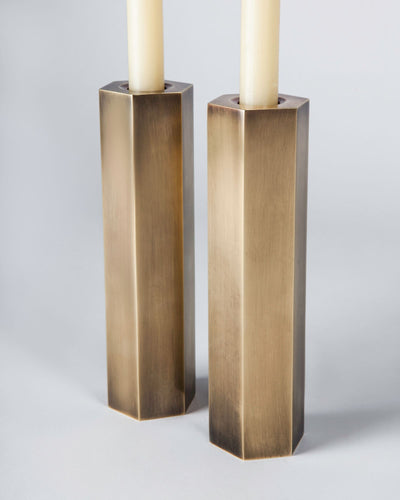 Remains Lighting Co. Collection image 1 of a Hex Candlestick Tall made-to-order.  Shown in Antique Brass.