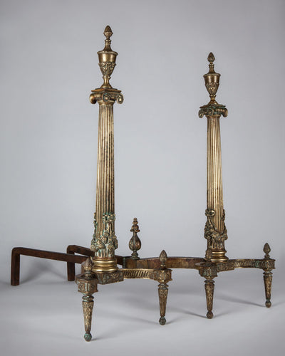 Vintage Collection image 1 of a pair of Neoclassical Andirons with Fluted Columns and Urn Finials antique in a Original Aged Brass finish.