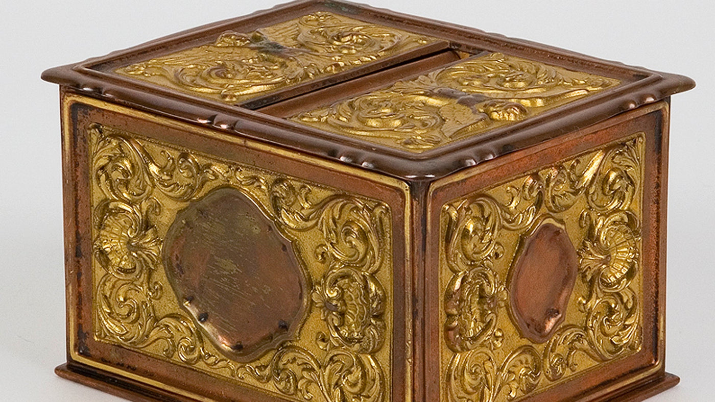 A Copper and Gilt Cigarette Box by Sterling Bronze Co., offered part of the antique collection at Remains Lighting Co.