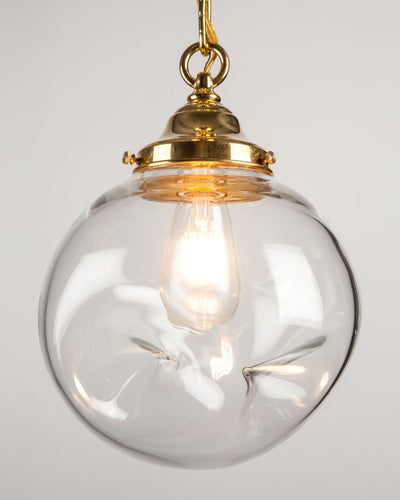 Remains Lighting Co. Collection image 1 of a Flux Hand Blown Glass Pendant made-to-order.  Shown in Polished Brass.