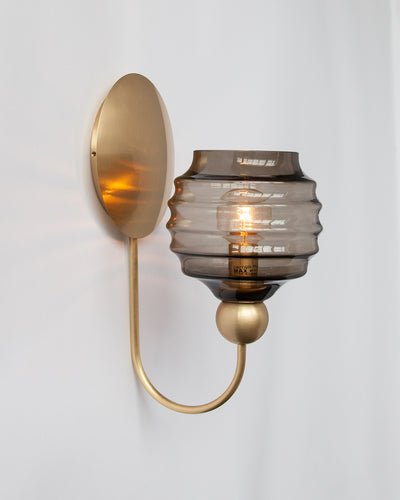 Remains Lighting Co. Collection image 1 of a Gloster Sconce with Beehive Glass made-to-order.  Shown lit in Burnished Brass with Dusk glass..