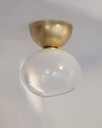 Remains Lighting Co. Collection image 1 of a Hemisphere Flush Mount with Dollop Glass made-to-order.  Shown in Burnished Brass with Sfumato glass.