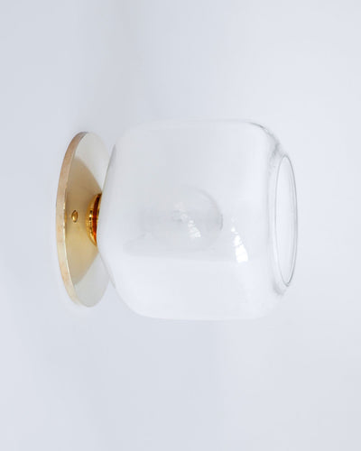 Remains Lighting Co. Collection image 1 of a Macci Flush Mount Sconce with Ice Cube Glass made-to-order.  Shown in Polished Brass with Sfumato glass.