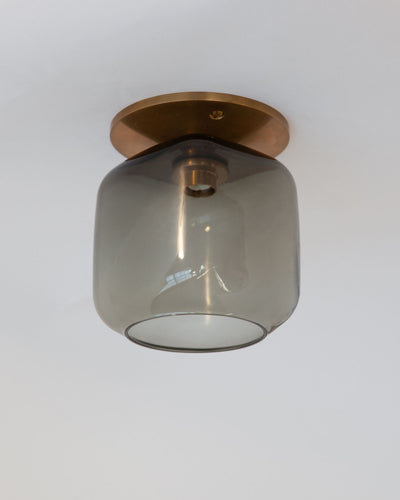 Remains Lighting Co. Collection image 1 of a Macci Flush Mount with Ice Cube Glass made-to-order.  Shown in Antique Brass with Dusk glass.