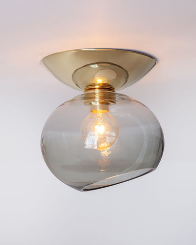 Remains Lighting Co. Collection image 1 of a Moderne Flush Mount with Dollop Glass made-to-order.  Shown lit in Polished Brass with Dusk glass.