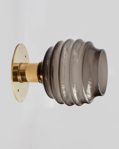 Remains Lighting Co. Collection image 1 of a Molecule Flush Mount Sconce with Beehive Glass made-to-order.  Shown in Polished Brass with Dusk glass.