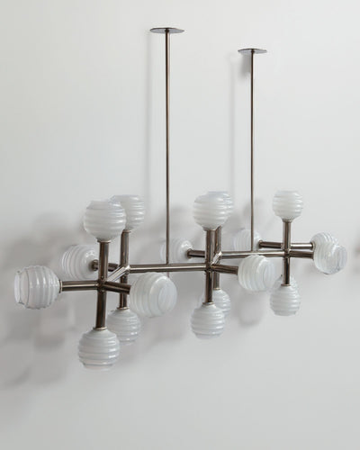 Robert and Trix Haussmann Collection image 1 of a Molecule Linear Chandelier with Beehive Glass made-to-order.  Shown in Burnished Nickel with Sfumato Glass.