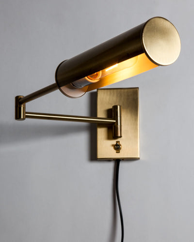 Vintage Collection image 1 of a pair of Nessen swing arm sconces antique in a Original Lacquered Brass finish.
