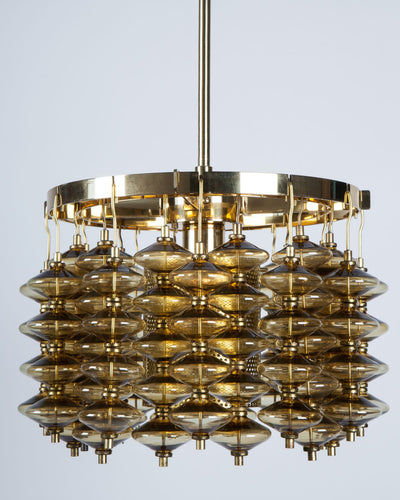 Vintage Collection image 1 of a Hans-Agne Jakobsson Chandelier with Amber Glass antique in a Original Aged Brass finish.