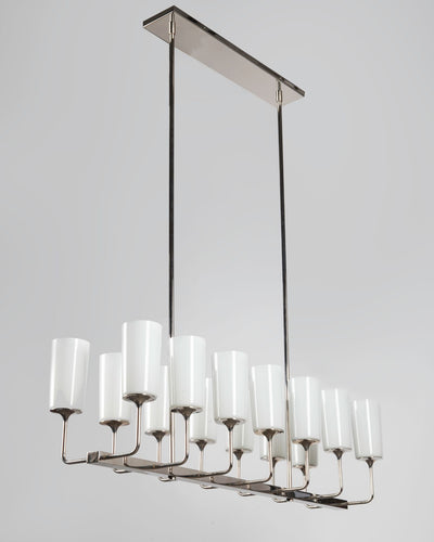 Remains Lighting Co. Collection image 1 of a Veronique Linear 14 Chandelier with Glass Shades made-to-order.  Shown in Polished Nickel with white glass shades.
